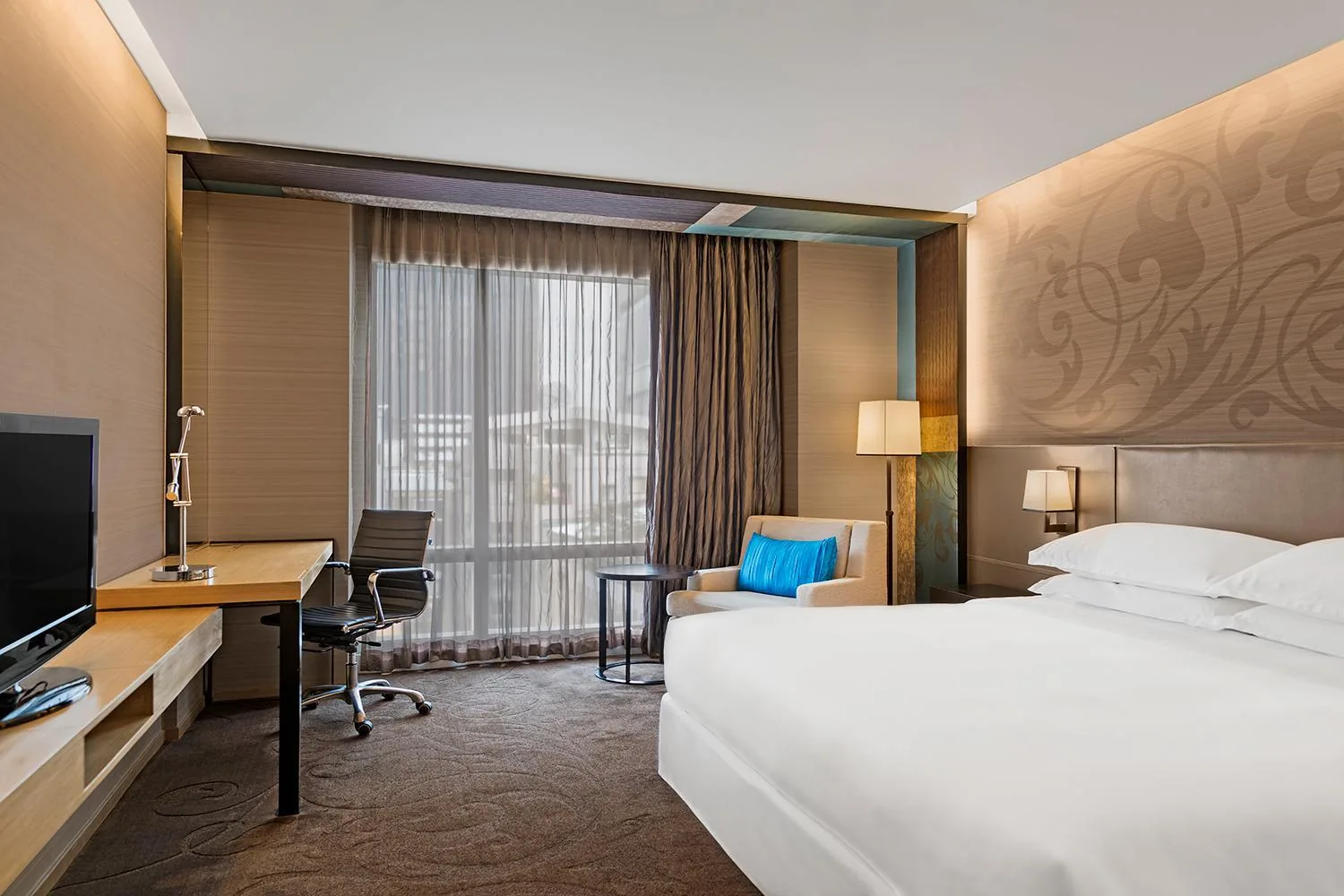 Paradox Bangkok guest room with a king bed and work area