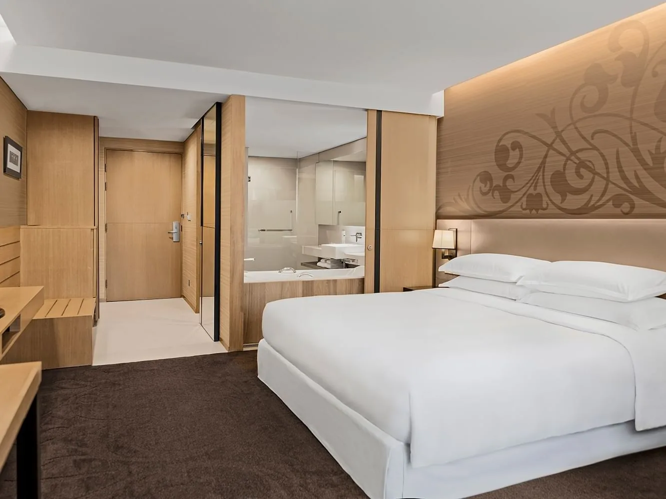 Paradox Bangkok Premier King room with king bed, desk and bathroom area