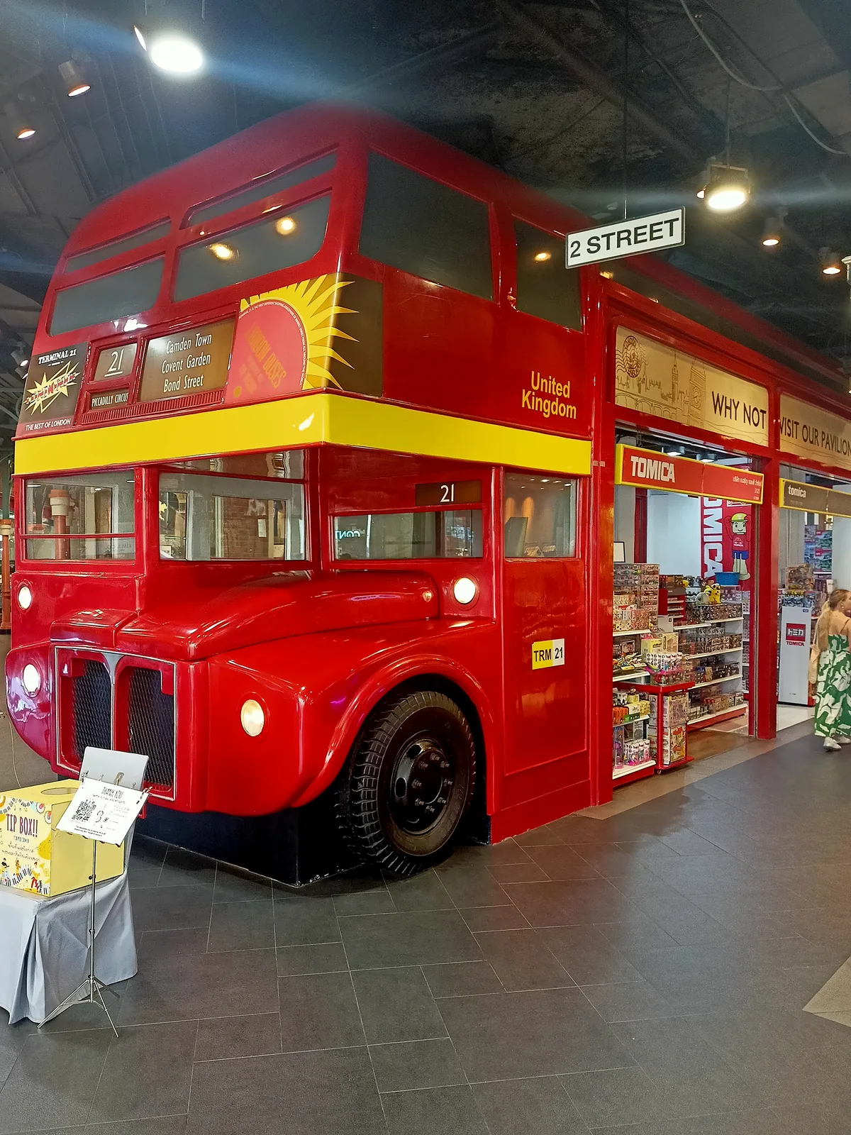 Red double-decker London bus installation inside Terminal 21 Asok