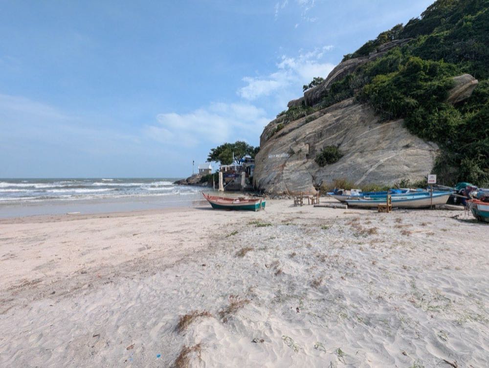Hua Hin beach curving north in daylight